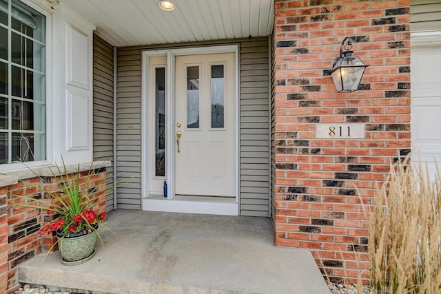 entrance to property featuring a porch