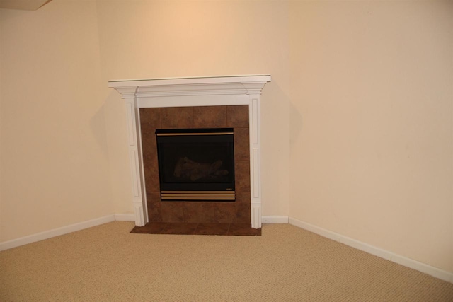 details featuring carpet, a fireplace, and baseboards