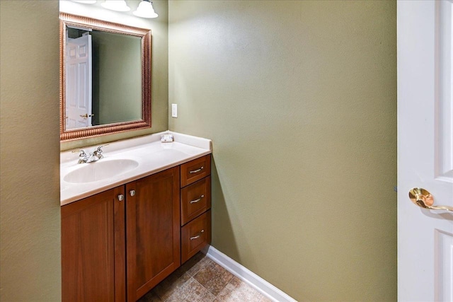 bathroom featuring vanity and baseboards