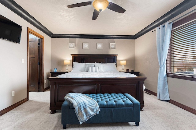 bedroom with light carpet, ceiling fan, baseboards, and ornamental molding