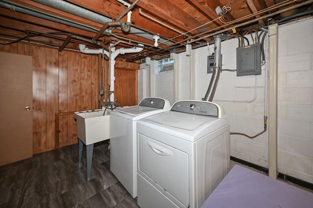 clothes washing area with laundry area, electric panel, and washing machine and dryer