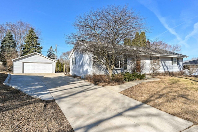 single story home featuring an outbuilding, a garage, and a chimney