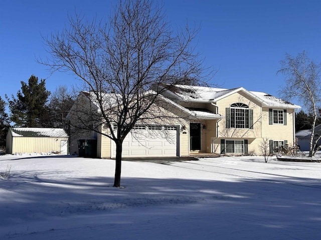 view of front of property featuring an outbuilding and an attached garage