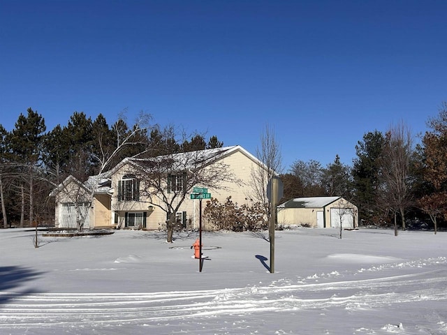 exterior space with a garage and an outdoor structure