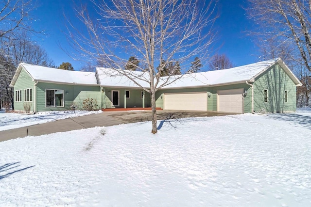 ranch-style home featuring an attached garage