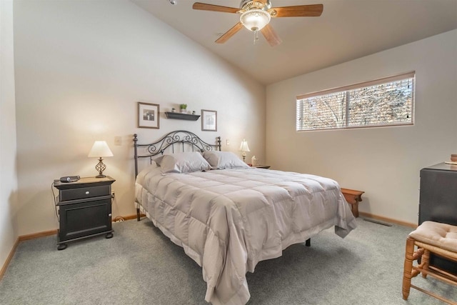 carpeted bedroom featuring lofted ceiling, ceiling fan, and baseboards