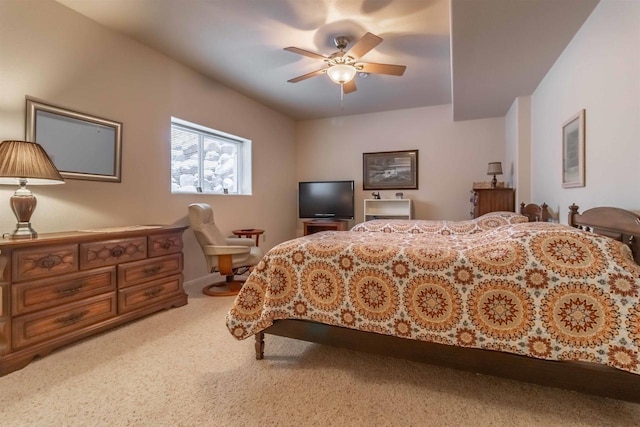 bedroom with ceiling fan and light colored carpet