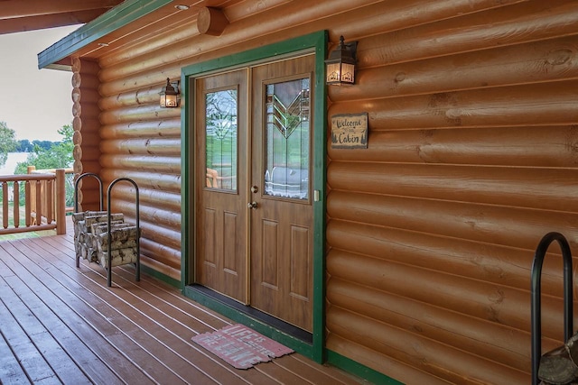 doorway to property featuring log exterior