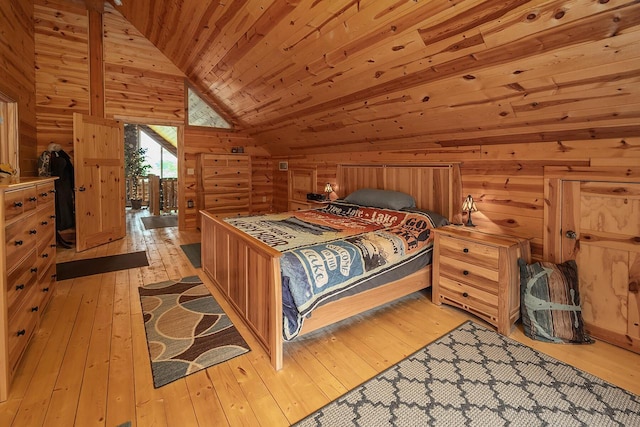 bedroom with lofted ceiling, light wood-style floors, wooden ceiling, and wood walls