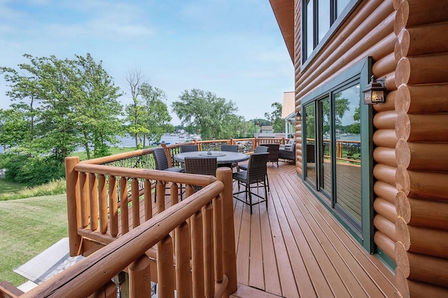 wooden terrace with outdoor dining space