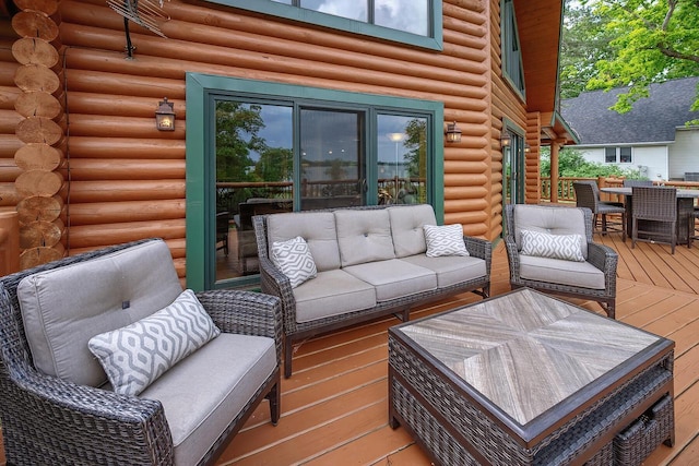 deck with outdoor dining space and outdoor lounge area