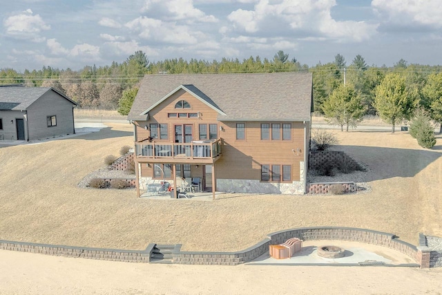 W5611 32nd St, New Lisbon, WI 53950 - view of front facade with a patio and an outdoor fire pit