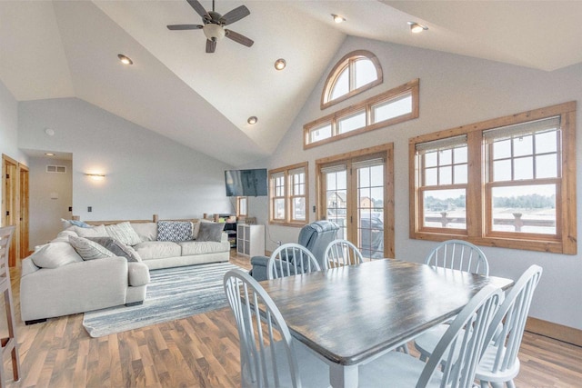 W5611 32nd St, New Lisbon, WI 53950 - dining space featuring recessed lighting, visible vents, ceiling fan, wood finished floors, and high vaulted ceiling