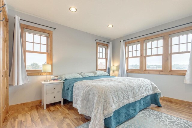 W5611 32nd St, New Lisbon, WI 53950 - bedroom with recessed lighting, light wood-style flooring, and baseboards