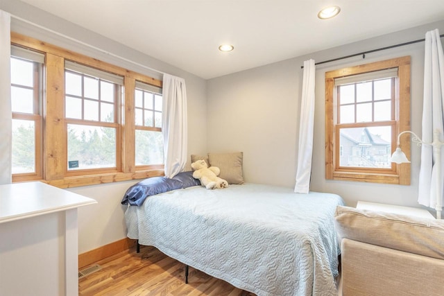 W5611 32nd St, New Lisbon, WI 53950 - bedroom featuring baseboards, light wood finished floors, visible vents, and recessed lighting