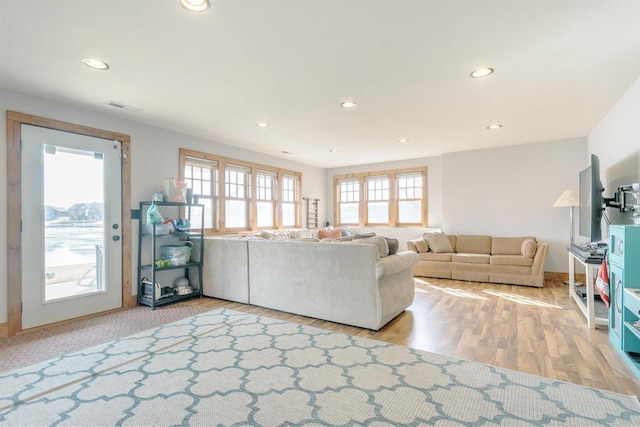 W5611 32nd St, New Lisbon, WI 53950 - unfurnished living room featuring baseboards, wood finished floors, visible vents, and recessed lighting