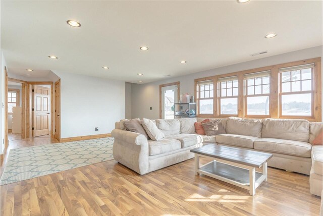 W5611 32nd St, New Lisbon, WI 53950 - living area featuring baseboards, light wood-type flooring, visible vents, and recessed lighting