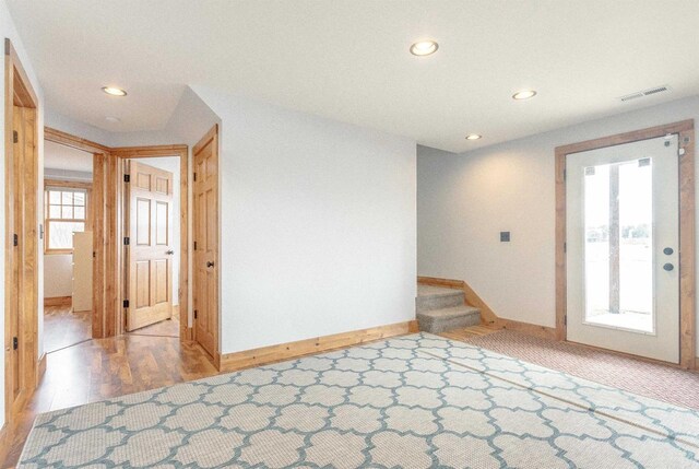 W5611 32nd St, New Lisbon, WI 53950 - empty room with recessed lighting, visible vents, baseboards, and stairs