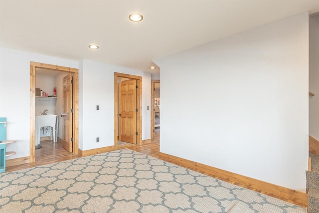 W5611 32nd St, New Lisbon, WI 53950 - unfurnished bedroom with baseboards, wood finished floors, and recessed lighting