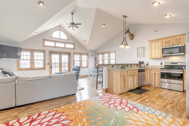 W5611 32nd St, New Lisbon, WI 53950 - kitchen with stainless steel appliances, open floor plan, and light brown cabinets