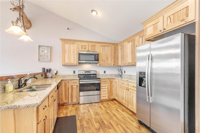 W5611 32nd St, New Lisbon, WI 53950 - kitchen with stainless steel appliances, light brown cabinets, a sink, and a peninsula