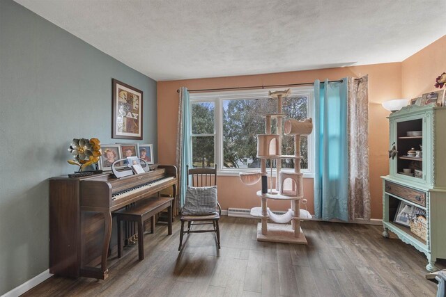 sitting room featuring wood finished floors and baseboards