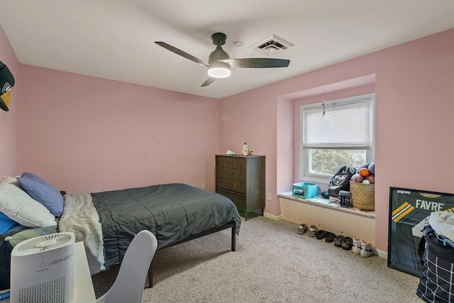 bedroom with carpet, visible vents, ceiling fan, and baseboards