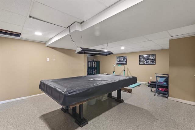 game room featuring a paneled ceiling, carpet floors, and baseboards
