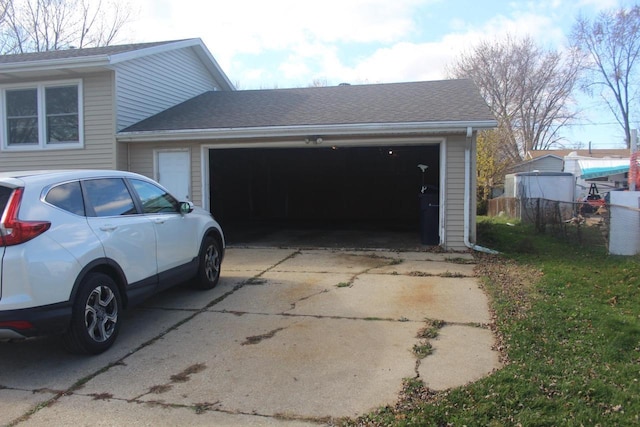 garage featuring driveway