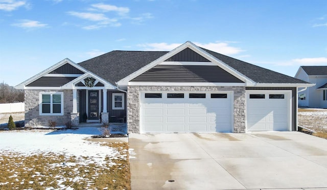 craftsman inspired home with board and batten siding, roof with shingles, driveway, and an attached garage