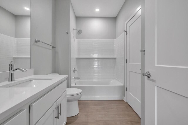 500 E Main St Unit 203, Waterford, WI 53185 - bathroom with toilet, shower / tub combination, wood finished floors, and vanity