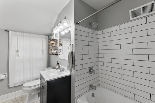 bathroom featuring vanity, visible vents, tile patterned flooring, bathing tub / shower combination, and toilet