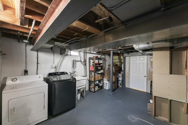 unfinished basement with washing machine and dryer