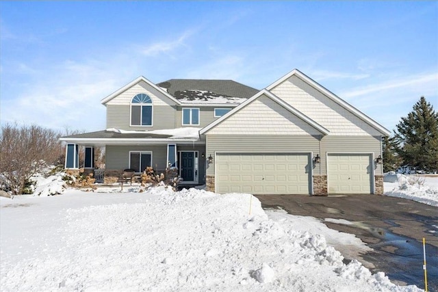 view of front facade featuring an attached garage, stone siding, and a porch