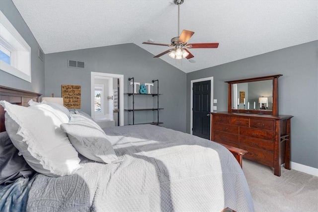 bedroom featuring light colored carpet, a ceiling fan, baseboards, vaulted ceiling, and visible vents