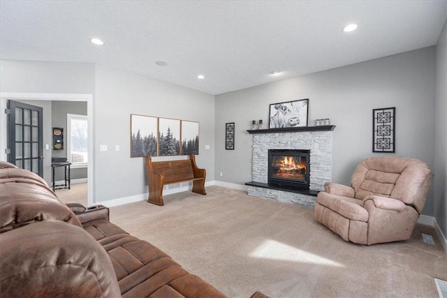 living room with light carpet, recessed lighting, baseboards, and a stone fireplace