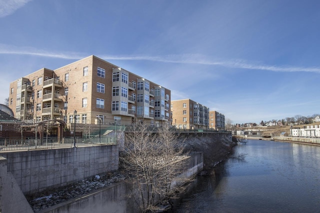 view of building exterior featuring a water view