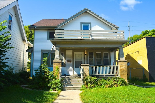 view of front of house with a porch and a balcony