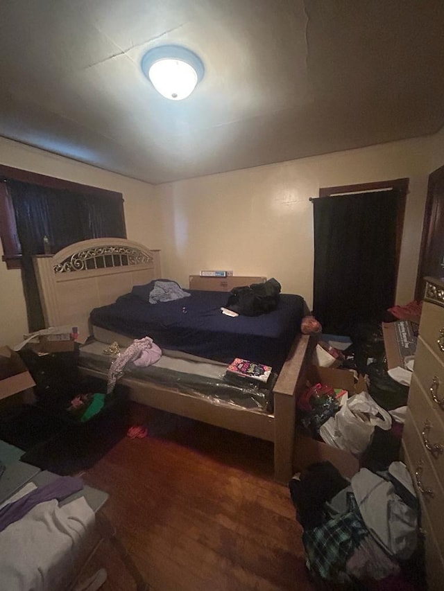 bedroom with wood finished floors