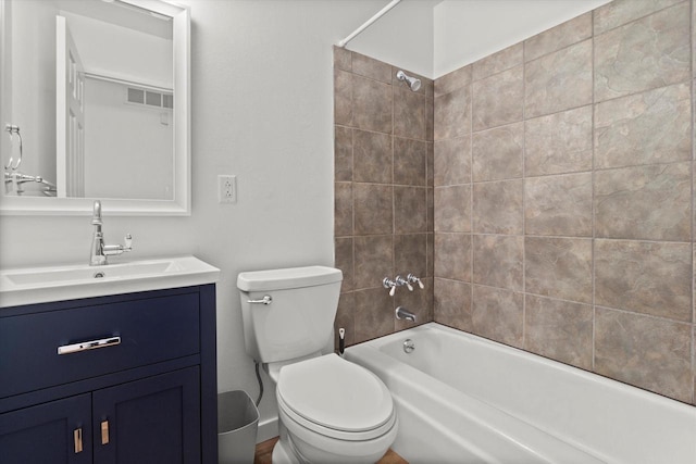 bathroom featuring toilet, shower / bath combination, visible vents, and vanity