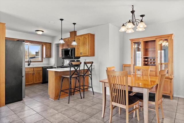 dining room featuring baseboards, light tile patterned flooring, and an inviting chandelier