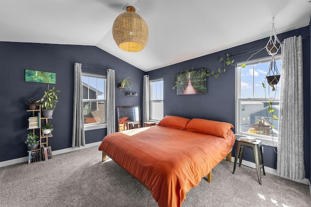 bedroom with lofted ceiling, carpet floors, multiple windows, and baseboards