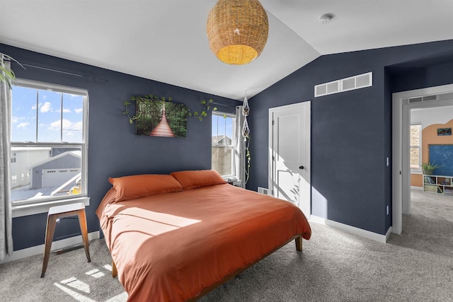 bedroom featuring carpet floors, baseboards, visible vents, and vaulted ceiling