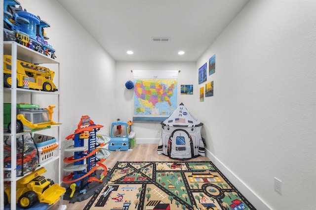 game room with recessed lighting, visible vents, baseboards, and wood finished floors