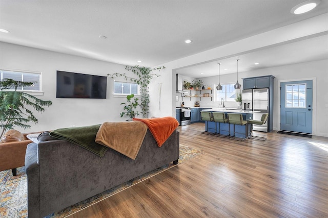 living room featuring light wood-style floors and recessed lighting