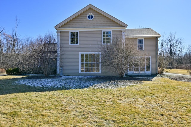 back of house featuring a yard