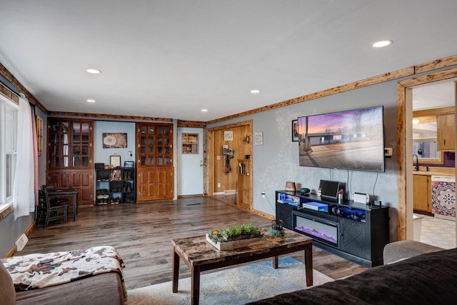 living room with wood finished floors and recessed lighting