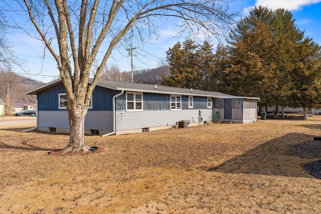 view of front of house with a sunroom