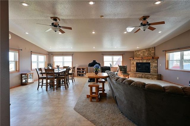 2451 25th Ave, Rice Lake, WI 54868 - living area featuring vaulted ceiling, a wealth of natural light, and a stone fireplace