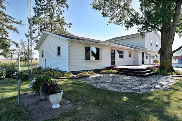 2451 25th Ave, Rice Lake, WI 54868 - rear view of property featuring a patio area, a deck, and a yard